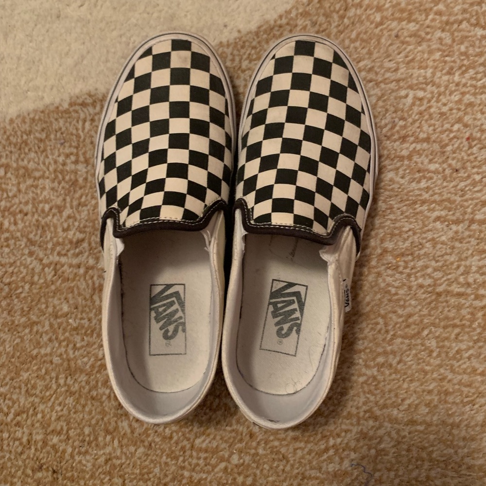 Checkered Vans slip-ons